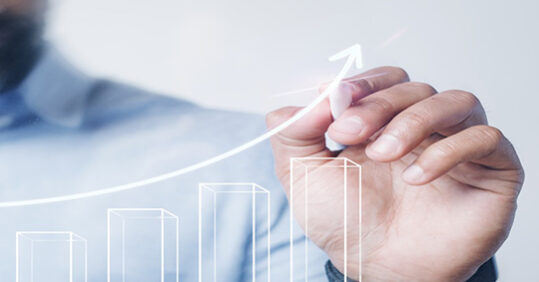 Man giving a bar graph presentation using a high technology digi Man giving a bar graph presentation using a high technology digital pen
